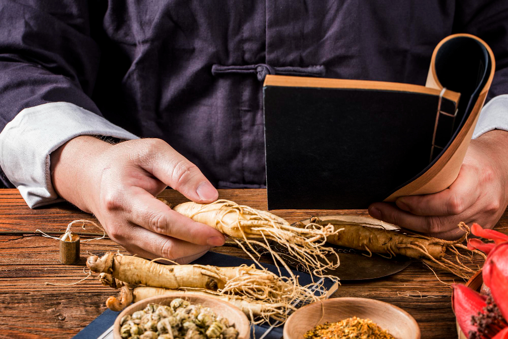 chinese medicine practitioner is selecting ginseng traditional chinese medicine